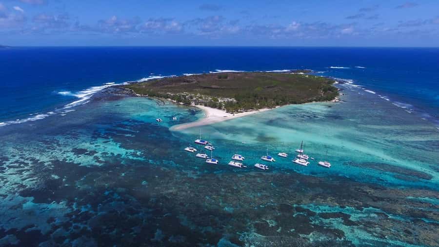 Full Day Catamaran Luxury Cruise to Northern Islands w Lunch - Gunners Coin: The Cliff Stop That Makes the Cruise Feel Dramatic